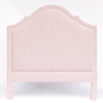 Pink upholstered headboard on a white background