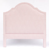 Pink upholstered headboard on a white background