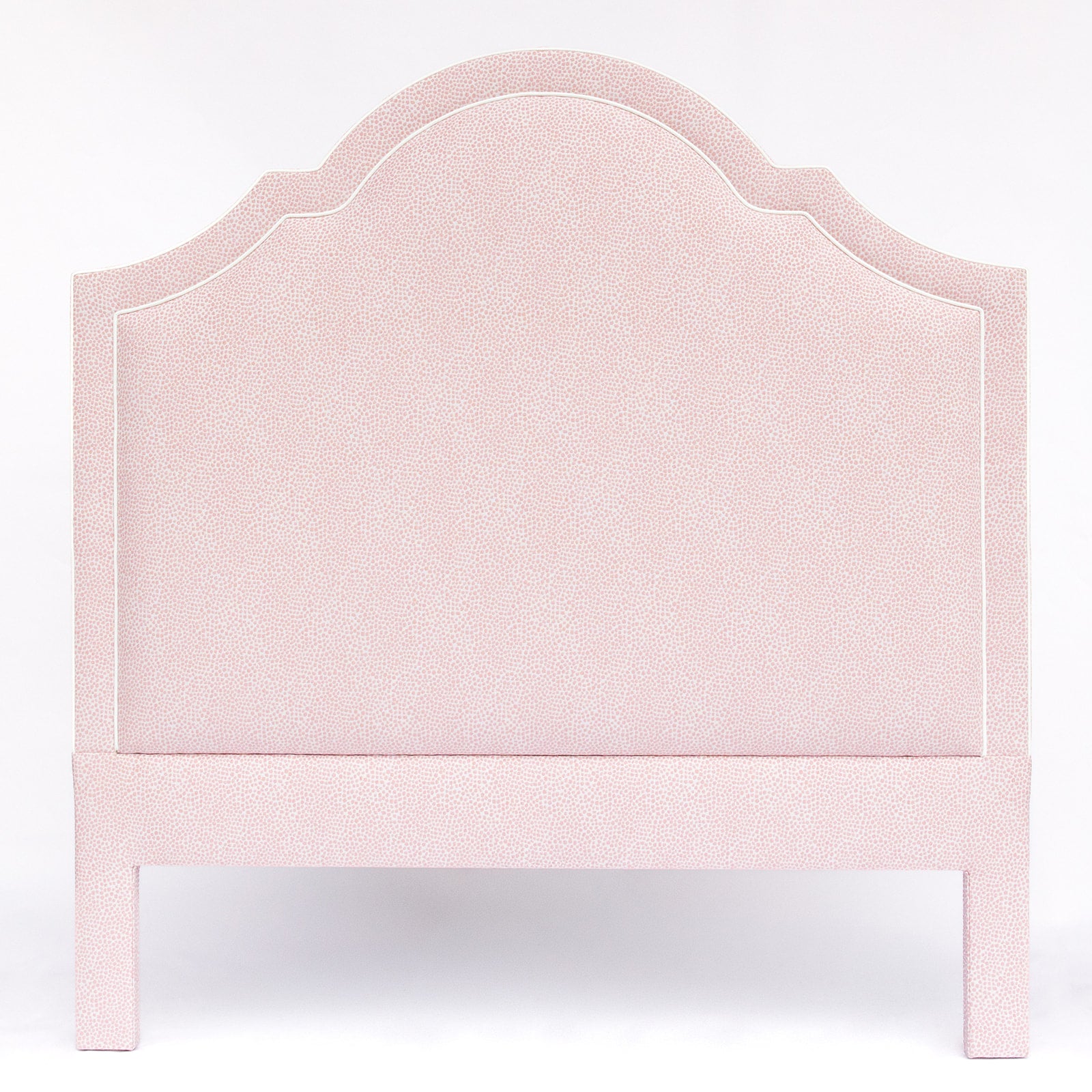 Pink upholstered headboard on a white background