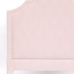 Pink upholstered headboard on a white background